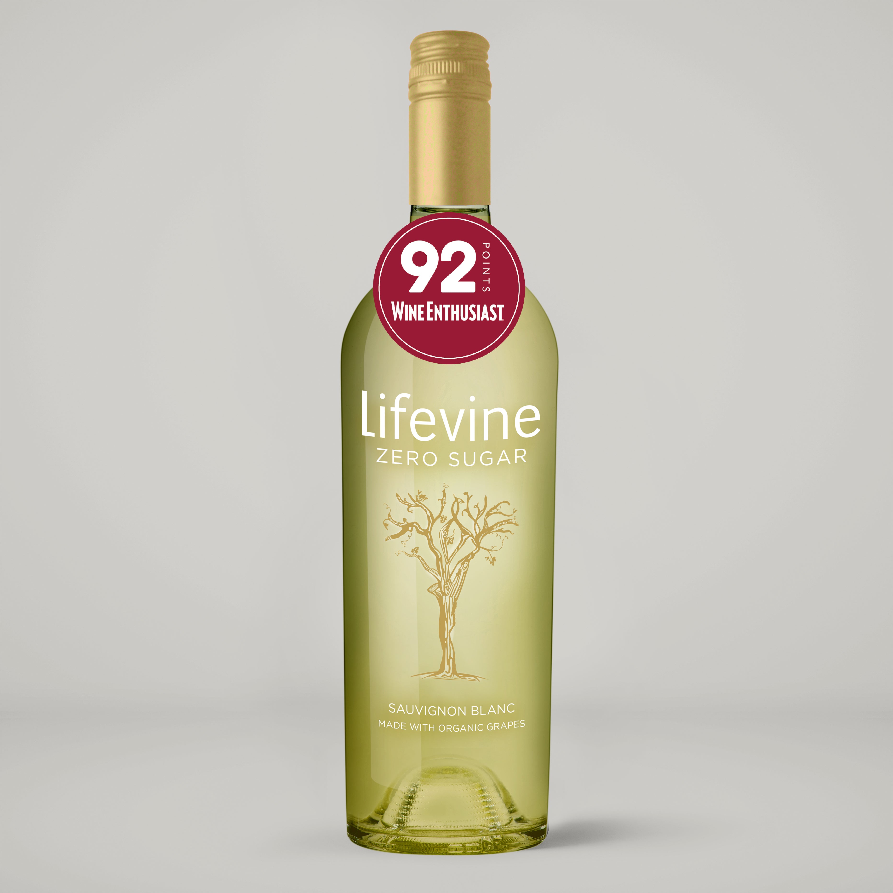 Bottle of Lifevine Zero Sugar Sauvignon Blanc with a Wine Enthusiast score label on a gray background